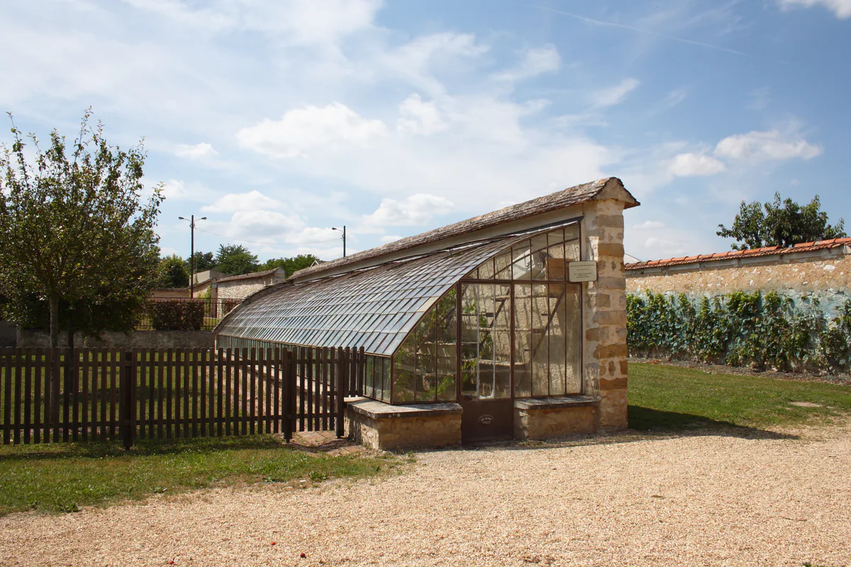 An old greenhouse and historic fruit walls in the village of Thomery